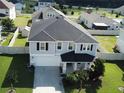 Two-story house, gray siding, black roof, and a large backyard at 2346 Upland Ln, Apopka, FL 32712