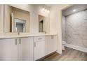 Modern bathroom with double vanity and a separate shower at 1308 Hillsborough Ct, Kissimmee, FL 34759
