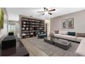 Spacious living room featuring built-in bookshelves and a cozy seating area at 106 Oregon Ave, Saint Cloud, FL 34769