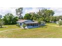 Aerial view of a single story home with large yard at 168 E Sunset St, Groveland, FL 34736