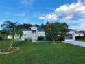 Single-story home with green lawn and palm tree at 1411 Swift Ct, Kissimmee, FL 34759