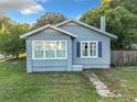 Blue house with white trim and blue shutters at 1628 S Grove St, Eustis, FL 32726