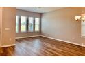 Dining room with hardwood floors and a chandelier at 15102 Stuttgart Aly, Winter Garden, FL 34787