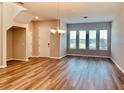 Bright dining room with hardwood floors and large windows at 15102 Stuttgart Aly, Winter Garden, FL 34787
