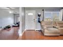 Home entryway with tiled floors, leading to living room and view of the backyard at 8116 Powell Dr, Orlando, FL 32822