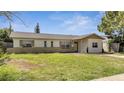 Front view of a single story house with a large yard at 8116 Powell Dr, Orlando, FL 32822