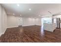 Open living space with dark hardwood floors and kitchen island at 5709 Ridgeway Dr, Orlando, FL 32819
