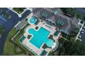 Aerial view of community pool with lap lanes and lounge chairs at 15692 Sw 16Th Ter, Ocala, FL 34473