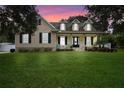 Beautiful two-story home with a charming front porch and well-manicured lawn at 70 Millholland St, Oakland, FL 34760