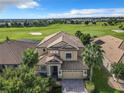 Luxury home with golf course views and beautiful landscaping at 8920 Dove Valley Way, Davenport, FL 33896