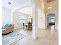 Bright dining room with tiled floors and a charming table set for four at 8920 Dove Valley Way, Davenport, FL 33896