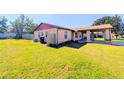 Single story home with a carport and well-maintained lawn at 7534 Golden Glenn Dr, Orlando, FL 32807