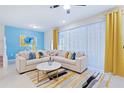 Spacious living room featuring a large sectional sofa and stylish decor at 710 Gardenia Ln, Davenport, FL 33897
