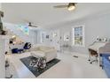 Bright living room with whitewashed floors and comfy seating at 424 Pelican Ave, Daytona Beach, FL 32118