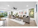 Bright living room with hardwood floors and comfy seating at 1603 Woodlyn Dr, Leesburg, FL 34748