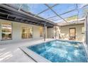 Inviting, refreshing pool with covered patio at 1603 Woodlyn Dr, Leesburg, FL 34748