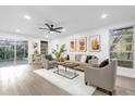 Bright living room with hardwood floors and comfy seating at 1603 Woodlyn Dr, Leesburg, FL 34748