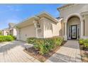 House exterior with double garage and walkway at 500 Arena Dr, Davenport, FL 33837
