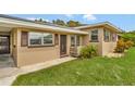 House exterior with brown shutters and a wood planter at 719 Osceola Ave, Lake Wales, FL 33853