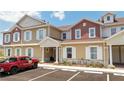 Inviting exterior of a two-story townhouse with landscaping at 7514 Sunflower Cir, Kissimmee, FL 34747