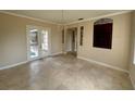Bright dining room with tile floors and access to the pool area at 7706 Excitement Dr, Reunion, FL 34747