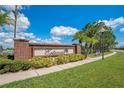 Estancia community entrance with brick signage and landscaping at 1033 Hacienda Cir, Kissimmee, FL 34741