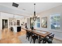 Farmhouse style dining room with large wooden table and chandelier at 13168 Lower Harden Ave, Orlando, FL 32827