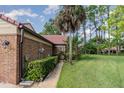 Brick exterior with lush landscaping at 116 Avocet Ct, Daytona Beach, FL 32119