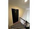 Apartment entryway with black door and patterned rug at 1944 Conway Rd # 6, Orlando, FL 32812
