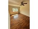 Bedroom with wood-look flooring and large window at 1944 Conway Rd # 6, Orlando, FL 32812