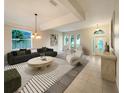 Bright living room with stylish furniture and large windows at 305 Porchester Dr, Sanford, FL 32771