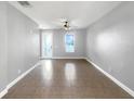 Bright living room with tile floors and neutral walls at 1563 Reflection Cv, Saint Cloud, FL 34771