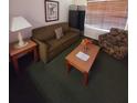 Cozy living room featuring a sofa, armchair, and coffee table at 4129 Southern Oaks Ct # 813, Kissimmee, FL 34741