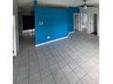 Large living area with tile floors and access to other rooms at 733 Robin Ct, Kissimmee, FL 34759