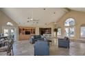 Spacious clubhouse with high ceilings, comfortable seating, and kitchenette at 4400 Thornbriar Ln # A202, Orlando, FL 32822