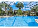 Inviting screened pool and spa with plenty of lounge space at 16328 Wind View Ln, Winter Garden, FL 34787