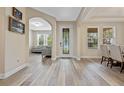 Elegant entryway with hardwood floors and arched doorway at 16328 Wind View Ln, Winter Garden, FL 34787
