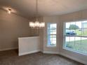 Bright dining room with chandelier and large window at 4306 Sagefield Dr, Harmony, FL 34773