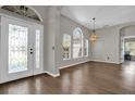 Elegant entryway with hardwood floors and stained glass door at 1409 Sutton Island Dr, Deland, FL 32724