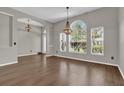 Bright dining area with hardwood floors and large windows at 1409 Sutton Island Dr, Deland, FL 32724