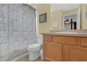Clean bathroom with shower/tub combo and wood vanity at 2718 Lido Key Dr, Kissimmee, FL 34747
