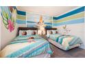 Bedroom with twin beds and Moana theme at 7554 Marker Ave, Kissimmee, FL 34747