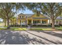 Two-story craftsman style home with front porch and landscaping at 8136 Key West Dove St, Winter Garden, FL 34787