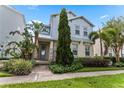 Two-story home with light blue siding and stone accents at 1407 Fairview Cir, Reunion, FL 34747