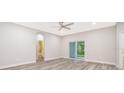 Bright bedroom with wood-look floors and access to a private bathroom at 250 S Virginia Ave, Deland, FL 32724