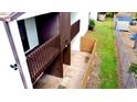 Backyard view of a condo unit with a small fenced patio area at 2649 Crown Ct # 2649, Kissimmee, FL 34741
