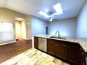 Kitchen with granite countertops, stainless steel appliances, and hardwood floors at 103 Tammie Sue Ln, Deland, FL 32724