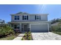 Two-story house with gray siding and stone accents at 2949 Sunset Dr, New Smyrna Beach, FL 32168