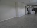Spacious living room with tile floors and neutral color palette at 3025 Ballad Rd, Kissimmee, FL 34746