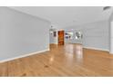 Bright living room with hardwood floors and a modern wood accent wall at 2811 Vine St, Orlando, FL 32806